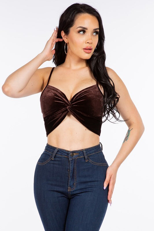 SLEEVELESS VELVET CROP TOP WITH TWISTED KNOT DETAIL.