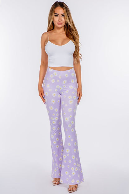 LONG FLARED PANTS WITH DAISY PRINT.IN BLACK.