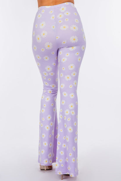 LONG FLARED PANTS WITH DAISY PRINT.IN BLACK.