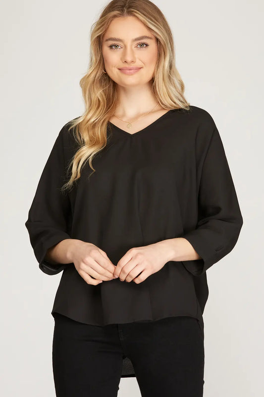 This 3/4 sleeve V-neck woven top, crafted from