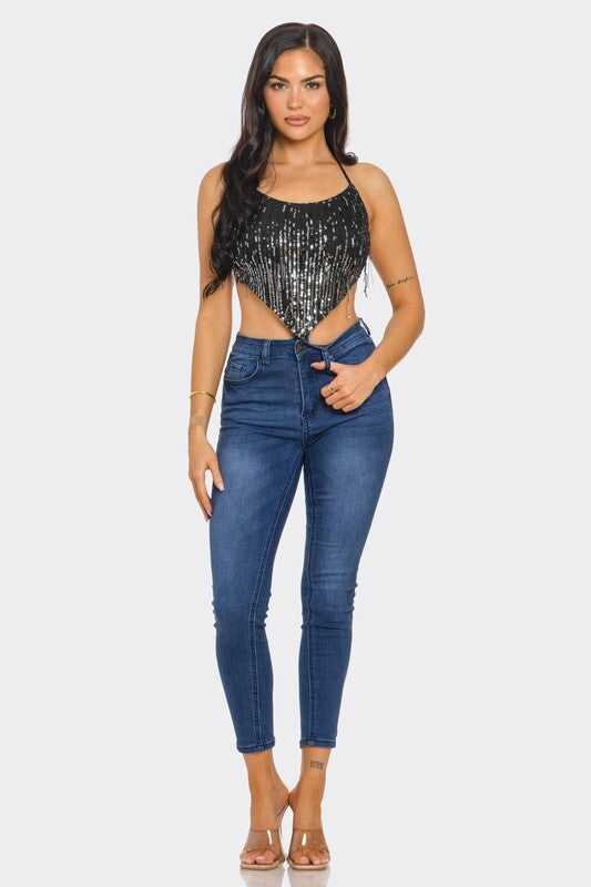 SEQUIN TOP WITH FRINGES AT THE OPEN BACK.
