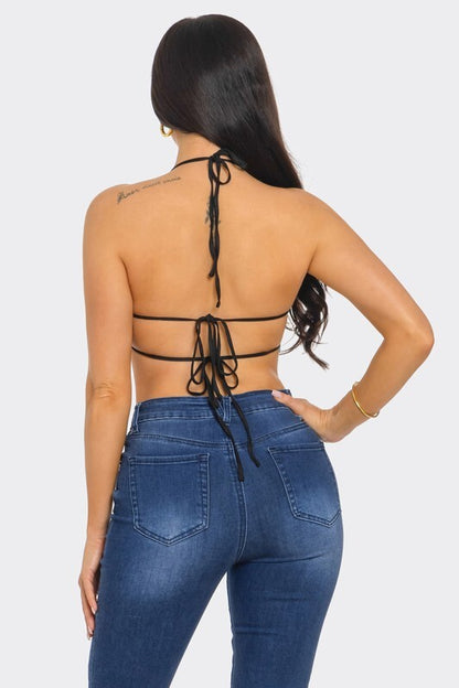 SEQUIN TOP WITH FRINGES AT THE OPEN BACK.