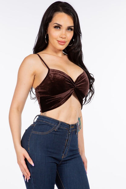 SLEEVELESS VELVET CROP TOP WITH TWISTED KNOT DETAIL.