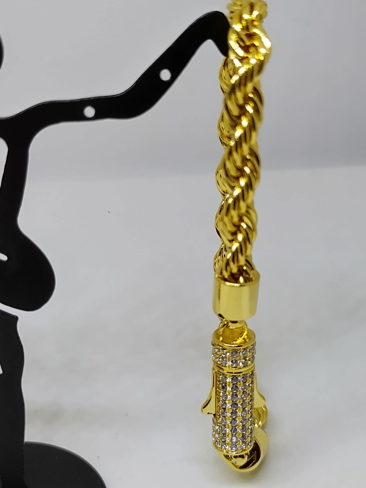 Gold bracelet with silver stone