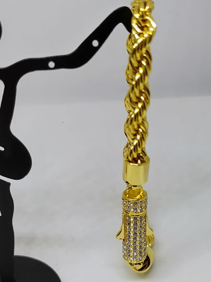 Gold bracelet with silver stone