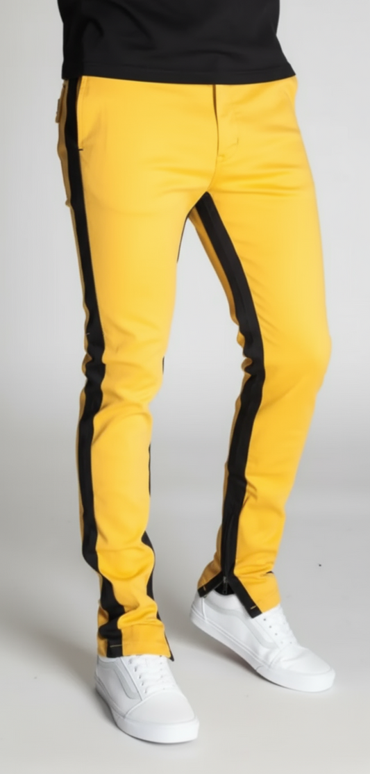 yellow pants with black stripes on the sides with zippers at the bottom ends