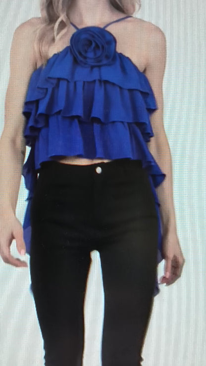 blouse features a halter neckline with ruffle