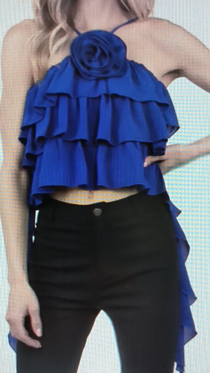 blouse features a halter neckline with ruffle