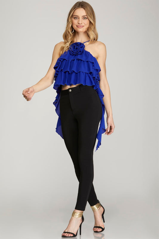 blouse features a halter neckline with ruffle